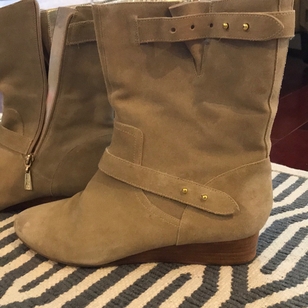 Mid leg suede wedge boots.